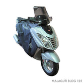 Coprigambe Termoscud®, un coprigambe impermeabile con fodera termica. In uso su scooter. Di TUCANO URBANO.